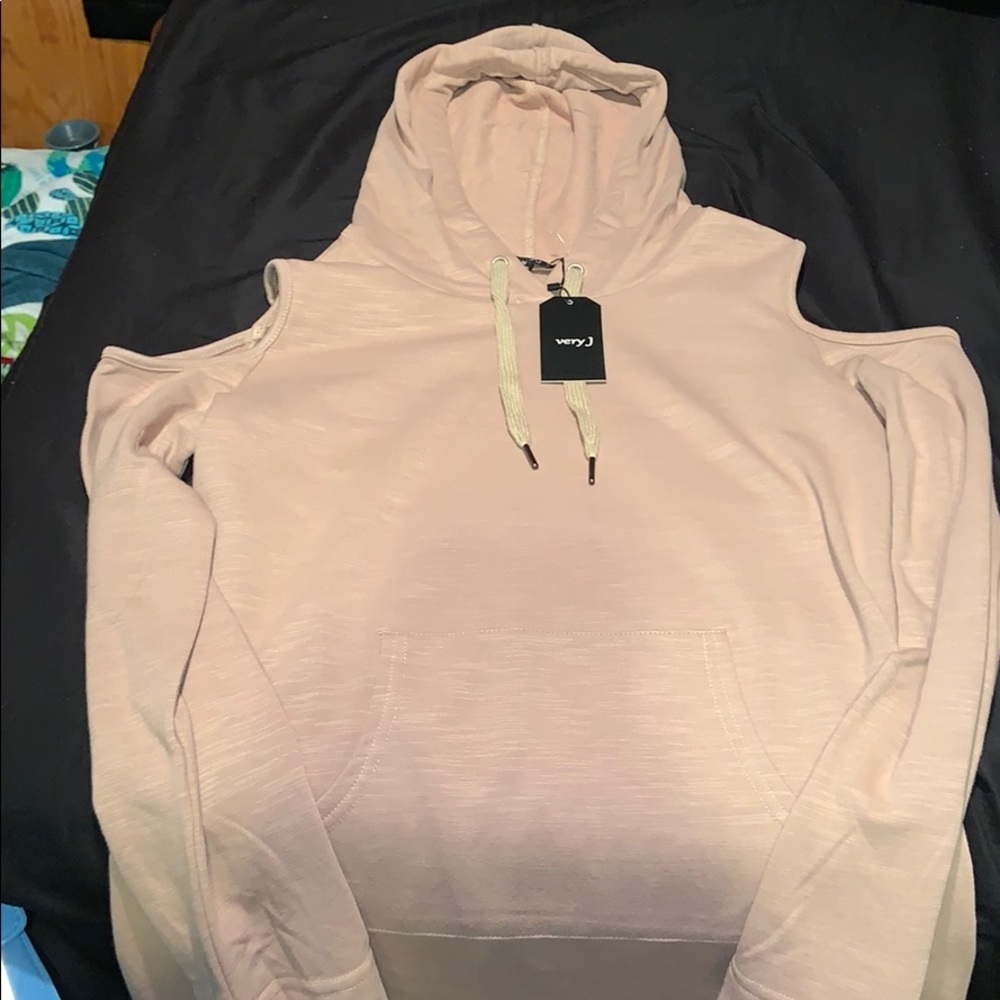 Pull over sweatshirt with the arm hole cut out.